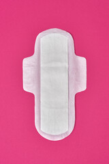 cotton sanitary pad napkin on pink fuchsia background