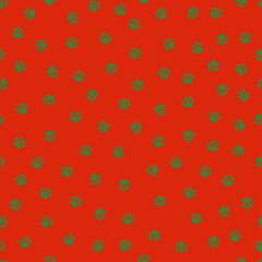 Seamless pattern with Christmas decoration. Green paws on red background.