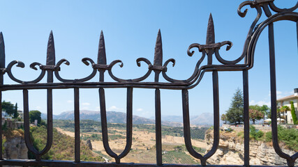 Naklejka premium Iron fence on the famous bridge of Ronda, Andalusia, Spain, named 