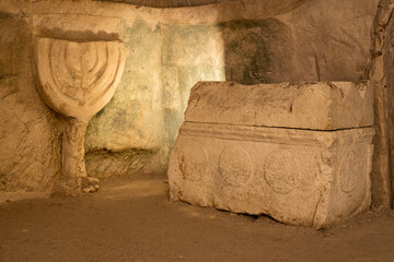 Mother of all menorahs and sarcophagus in the Cave of the Coffins at Bet She'arim in Kiryat Tivon, Israel

