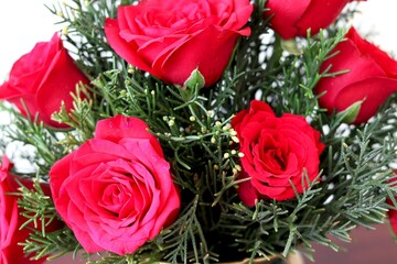 bunch of artificial red rose in flower vase