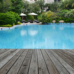 Wood platform beside swimming pool.