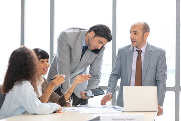 furious businesspeople arguing strongly, having disagreement and conflict for works on the table in conference room