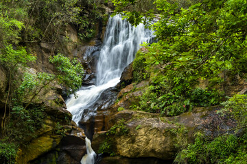 Fototapeta na wymiar Cachoeira entre pedras na Cidade de São Tomé das Letras Minas Gerais Brasil