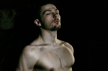 Young attractive guy posing in the studio.