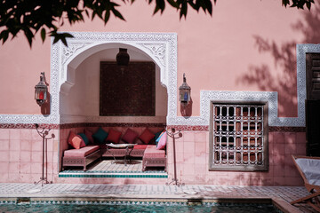 Oriental hospitality. Traveling by Morocco. Relaxing in festive moroccan traditional riad interior...