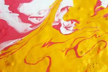Abstract background of red-white-yellow marble. The lines and waves of acrylic paint create an interesting structure. Background for web design, fabric, design,