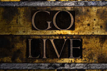 Go Live text message on textured grunge copper and vintage gold background