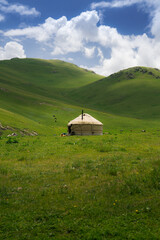 Yurt in the mountains, pastures for cattle and the nomadic lifestyle of the Kyrgyz. Far from the...