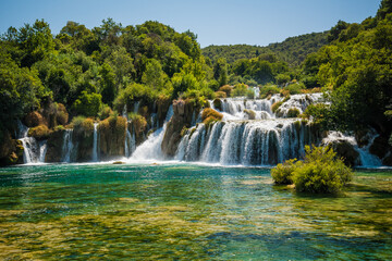 Fototapeta na wymiar Beautiful Skradinski buk waterfall with crystal clear water in Krka National Park, Croatia