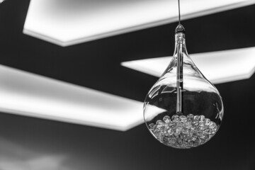 modern ceiling with lighting and lamps with abstract design black and white photo