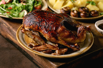 Classic dish roasted glazed duck with apples and garnish