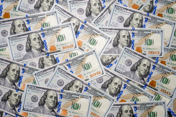 Background with lots of hundred dollar bills.