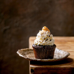 Homemade chocolate cupcakes muffins with white whipped butter cream