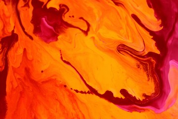 Abstract orange marble background. The lines and waves of acrylic paint create an interesting...