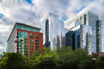 Boston Skyline and Cityscape over the green park. Abstract architectural geometry of modern buildings in downtown Boston, Massachusetts.
