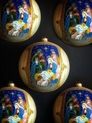 Pattern from beautiful christmas balls. Background from christmas balls with the image of the birth...