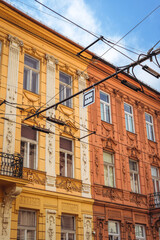 Fototapeta na wymiar Orange and Yellow Slovakian Buildings and a Blue Sky