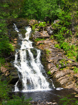Yukankoski waterfall or White bridges on the river Kulismayoki, Russia, Karelia. Scenic view at wood waterfall