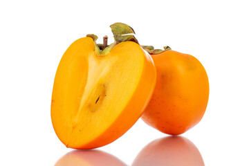 Fototapeta na wymiar Two halves of sweet persimmon, close-up, isolated on white.