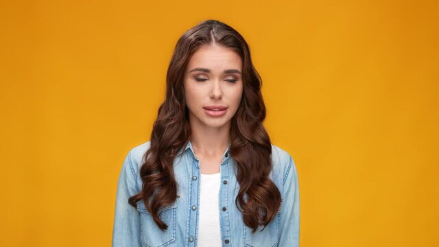 Cute guilty girlfriend bite lip look away avoid romantic reveal