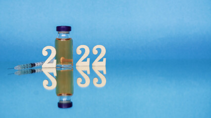vaccine ampoule and number 2022, vaccination in new year 