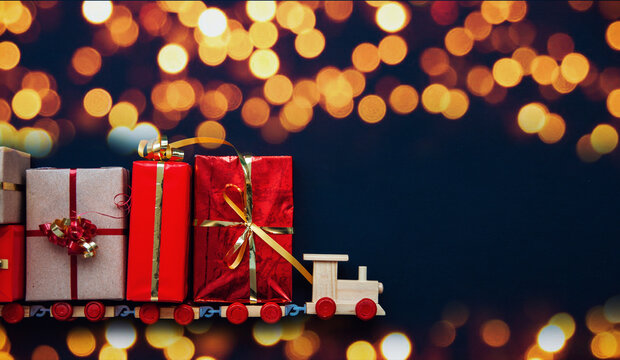 kids train 2022 with Christmas presents box , Merry Christmas and happy New Year card celebration old craft styling	
