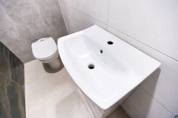 Fototapeta premium toilet bowl in the apartment after repair, repair in a new building