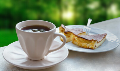 Cheesecake slices, cheesecake slices on white plate with coffee or black tea on nature background. 