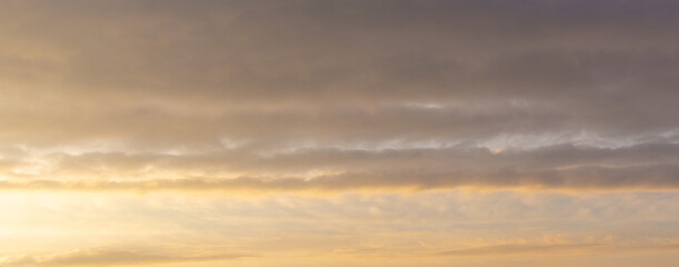 Naklejka na ściany i meble Sky with thick clouds at sunrise or sunset