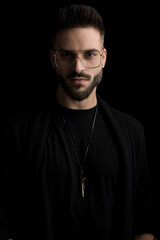 dramatic cool guy wearing eyeglasses and posing in a fashion way