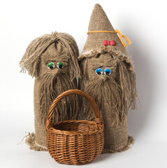 two Russian toy brownies with a basket, on a white background