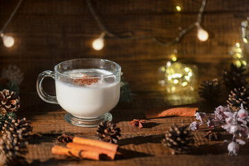 Eggnog Christmas drink on wooden background