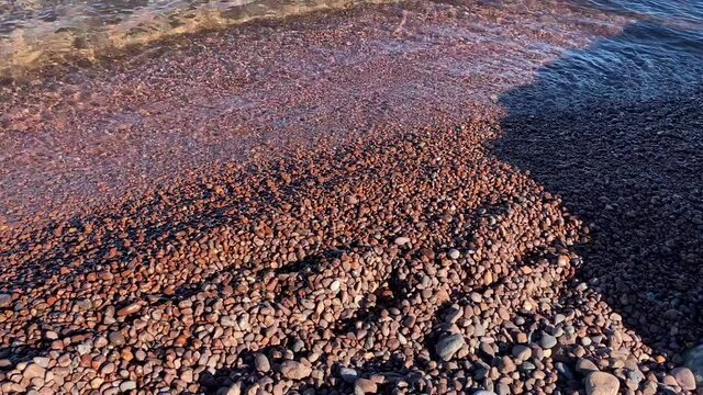 Pink agate stones on the shores of Lake Superior in Michigan