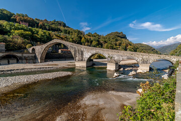 Beautiful panoramic view of Ponte della Maddalena, Devil's bridge, Borgo a Mozzano, Lucca, Tuscany,...