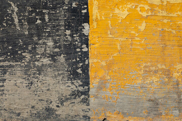 Background texture painted on the ground, uncorked, of two colors, yellow and black, in the port of...