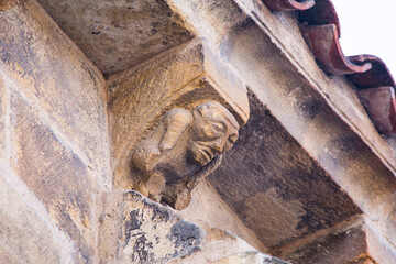 mysterious corbel under the eaves of the church of Santa María de la Oliva, Villaviciosa, Asturias. Romanesque and pre-Romanesque of Asturias, Spain. corbel of the church of La Oliva © Berto