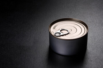 Canned delicious fresh tuna in oil with salt and spices in a tin can