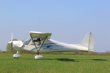 Ultralight airplane on a grass strip	