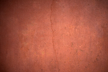 The texture of the metal wall is red. Iron background for the text. Metal production.