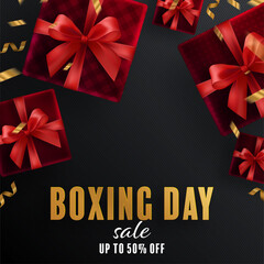 Boxing day sale or black friday shopping concept design of red, gold, black, boxing gloves holding for happy time with decorative elements cut style on color Background. 