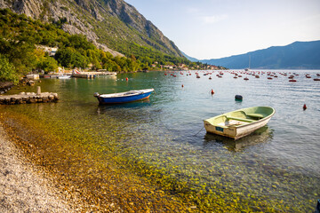 Fototapeta na wymiar Fishing boat on an oyster farm in the Bay of Kotor, Montenegro