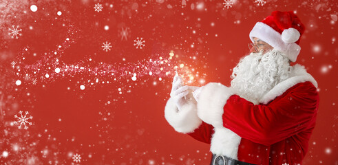Portrait of Santa Claus with mobile phone on color background with space for text