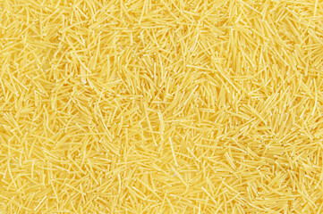 Yellow small noodle background texture.