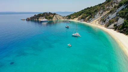 Poster Aerial panoramic wide photo of paradise turquoise Gidaki beach and moored luxury boats in Ithaca Greece © Haris Photography