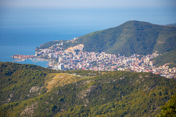 Aerial view of Budva Town in Montenegro . Panorama of Adriatic Coast and green mountains
