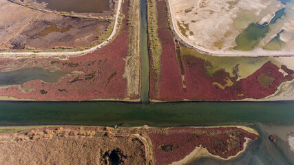 Aerial view of red colored salt pans at West Greece