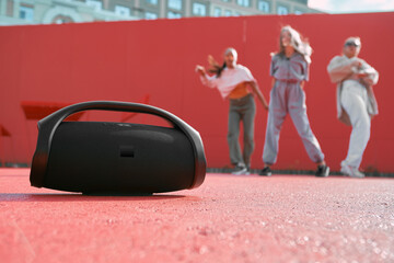 Wireless outdoor portable speaker product presentation. Dance floor placement of device. Copy space...