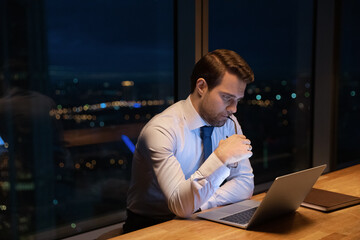 Confused young businessman entrepreneur manager considering difficult problem solution, managing...