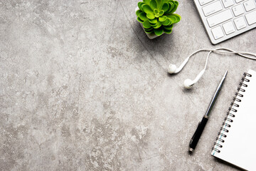White desk office with laptop, smartphone and other work supplies with cup of coffee. Top view with...